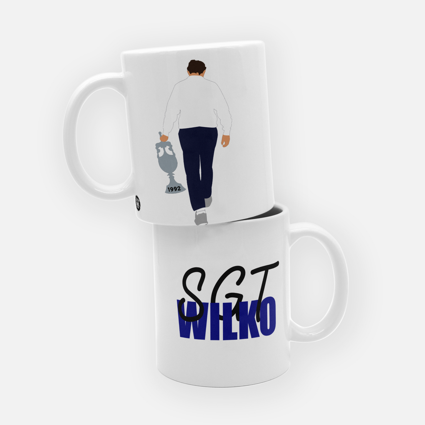 Celebrate Leeds United's iconic 1992 First Division title win with this Howard Wilkinson mug, honoring the legendary manager who led the club to glory. Featuring an illustration of Wilkinson and nods to Leeds United's historic triumph, this mug is the perfect gift for any Whites fan. Whether you're reliving the glory days or adding a unique piece to your collection, this mug captures the spirit of one of the club's greatest achievements. Ideal for your morning coffee or tea, show your Leeds United pride wit