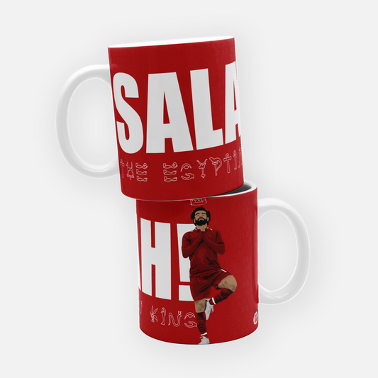 Liverpool FC mug featuring the slogan 'Egyptian King' in an Egyptian-style font, alongside the chant 'Mo Salah running down the wing,' celebrating the legendary forward.